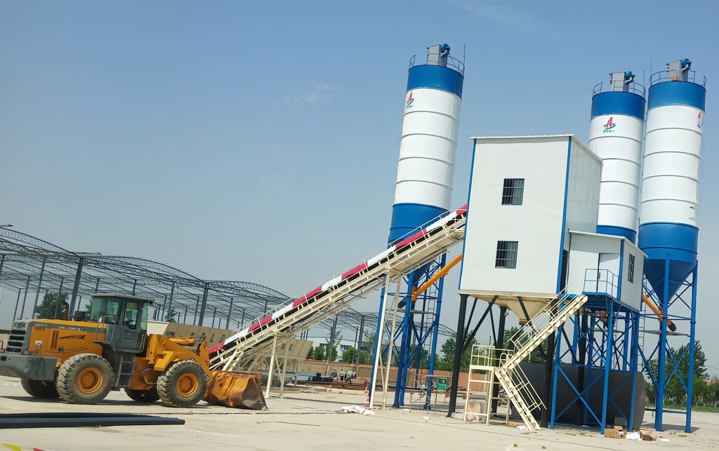 HZS90 stationary batching plant project with aggregate bins and concrete mixing tower